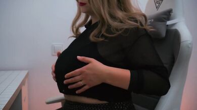 Red lips wet fingers busty MILF in chair fucking herself hard while watching porn