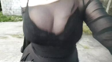 Brunette bombshell flashes big tits in public stockings