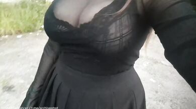 Brunette bombshell flashes big tits in public stockings