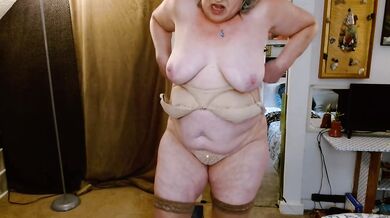 GILF DawnSkye gets ready for wild solo time in thigh highs thong lacy bra and ankle boots