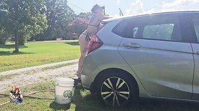 Little elfy gets her ass soaked while washing my car