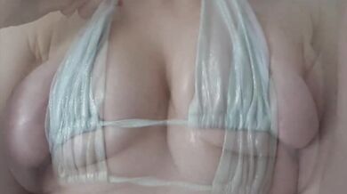 Oiled up Irish beauty with bouncing tits in slow motion wrecks her tiny bikini