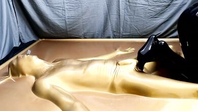 Latex Lovers Trapped in Gold Bondage