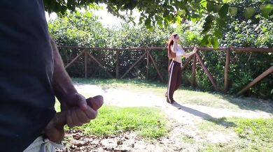 Redhead risks public cumshot tease in park