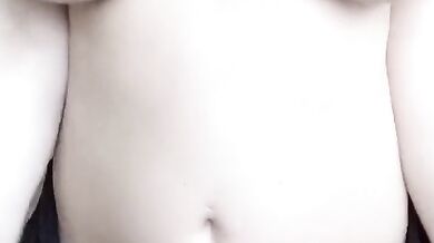 Teasing UK brunette masturbates with her huge natural tits