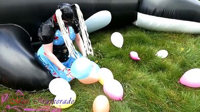 Miss Maskerade’s Rubber Doll Bursting Balloons And Gushing In Latex 02