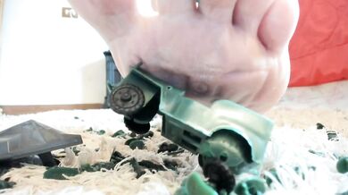 Giantess crushes toy soldiers flat with her massive feet