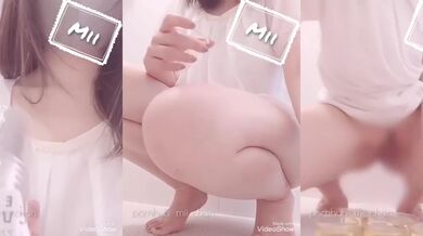 Japanese girl’s hairy pussy gets peed in a cup while clit erection twitches