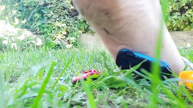 Giantess giant sweaty feet crushes toy cars into mash under her soles