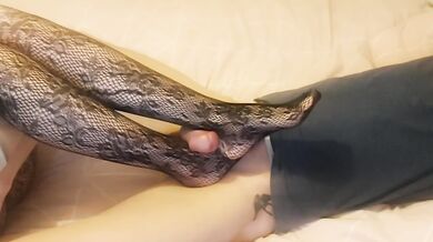 Late night femdom tramples slave’s cock with nylon feet until he’s milked over her toes