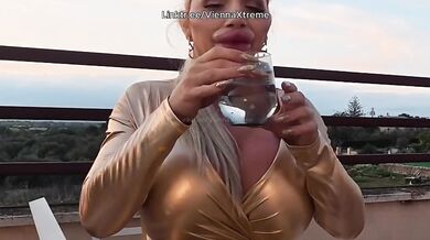 Bimbo with giant lips tries to drink without making a mess no glass works