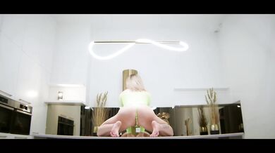 MILF Laura Dante flashes glistening pussy on table poised for you