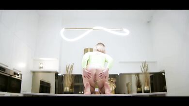 MILF Laura Dante flashes glistening pussy on table poised for you