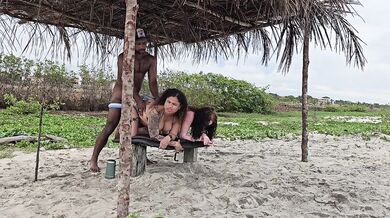 Milf rides two tight butts on beach drenching them with cum