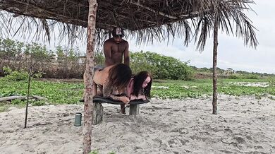 Milf rides two tight butts on beach drenching them with cum