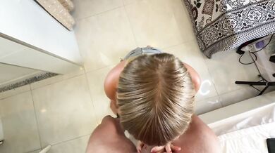 Blonde teen deep throats that monster cock while slurping on his balls
