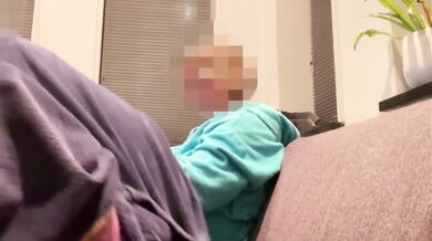 Wife gives casual handjob on couch while watching TV side view milf