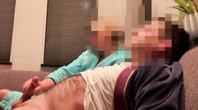Wife gives casual handjob on couch while watching TV side view milf
