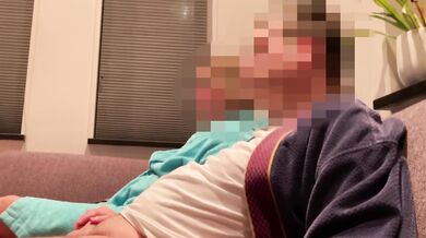 Wife gives casual handjob on couch while watching TV side view milf