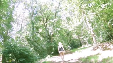 Milf in wedges spreads big ass in forest flashing bare cunt