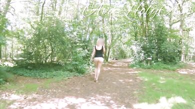 Milf in wedges spreads big ass in forest flashing bare cunt