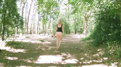 Milf in wedges spreads big ass in forest flashing bare cunt