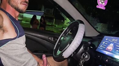 Flashing his thick cock to two horny brunettes in the town square at night