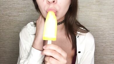 Brunette teen gets messy licking melting ice cream all over her fingers