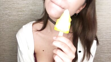 Brunette teen gets messy licking melting ice cream all over her fingers