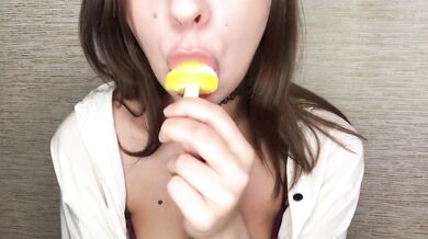 Brunette teen gets messy licking melting ice cream all over her fingers