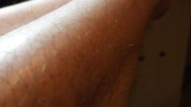 Hairy legs and black panties close up