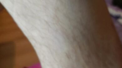Hairy legs and black panties close up