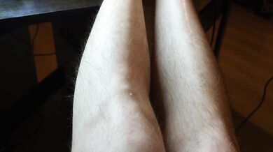 Hairy legs and black panties close up