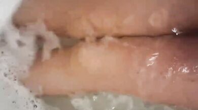 Soaked in stockings teasing her husband while solo in the tub