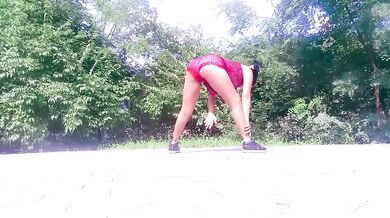 Motorcycle biker ebony goddess teases and yoga stretches in the park for hungry eyes