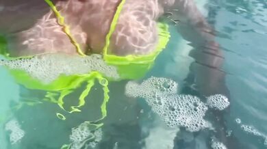Sexy Italian Milf Artemisia flashes her juicy big tits in public pool water