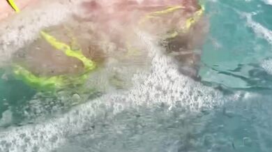 Sexy Italian Milf Artemisia flashes her juicy big tits in public pool water