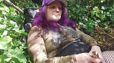 Naughty milf fingers herself in the forest till her pussy drips dirty talk