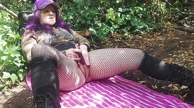 Naughty milf fingers herself in the forest till her pussy drips dirty talk