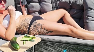 Cucumber stuffed pussy gets vegetables fucked raw outdoors