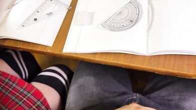 Schoolgirl getting off in math class with a footjob and blowjob under the table