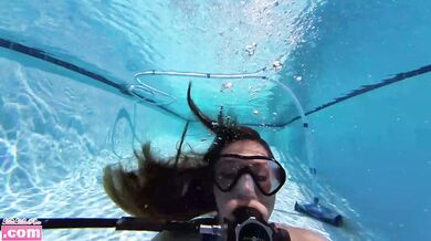 Barefoot teen scuba tank solo rolling girl under water fit challenge