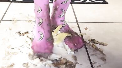 Big feet in socks squish and crush bananas while worshipping cum