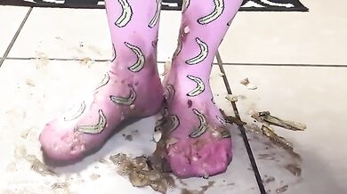 Big feet in socks squish and crush bananas while worshipping cum