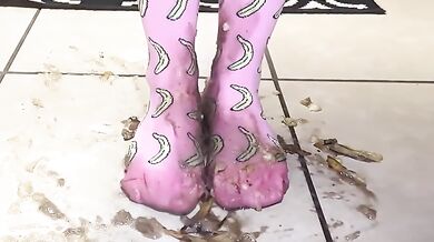 Big feet in socks squish and crush bananas while worshipping cum