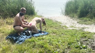 Master takes his leashed slave raw at the lake public fuck while gagging on his cum