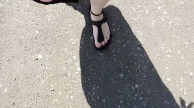 Black caftan and barefoot Birkenstocks in the wild