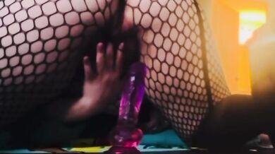 Bored emo girl with big tits rides a huge dildo in fishnet stockings