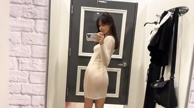 Petite brunette stripped bare in see-through fitting room reveals tiny natural tits