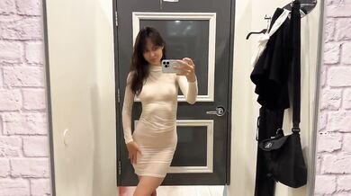 Petite brunette stripped bare in see-through fitting room reveals tiny natural tits